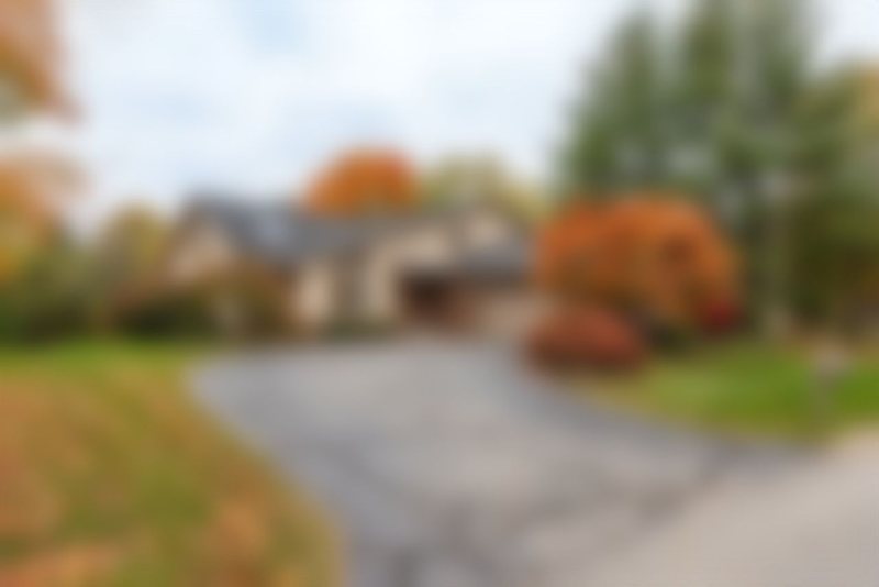 A blurred house, shown for illustration only.
